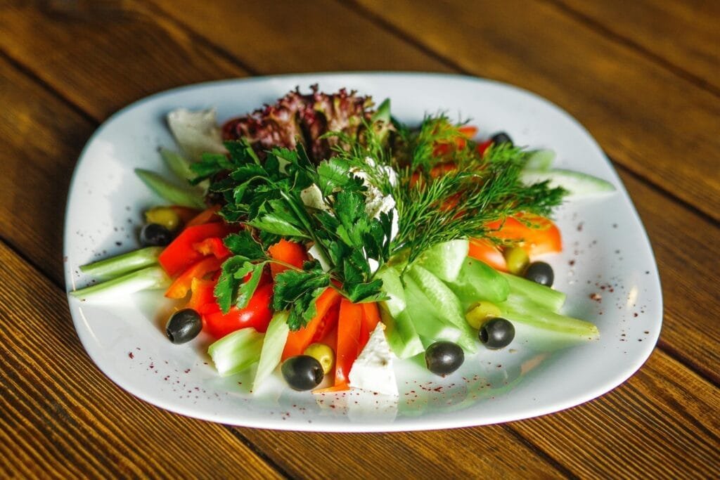nutrients essential for skin health Lins Hearts Sliced Vegetables on White Plate